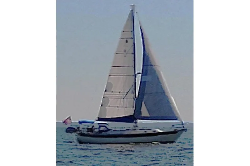 Trouvaille Yacht Photos Pics 1984 Slocum 43 sailboat cruising on open water with full sails.