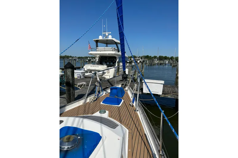 Trouvaille Yacht Photos Pics Sailboat docked at marina, Slocum 43, 1984 model, sunny day, clear blue sky.