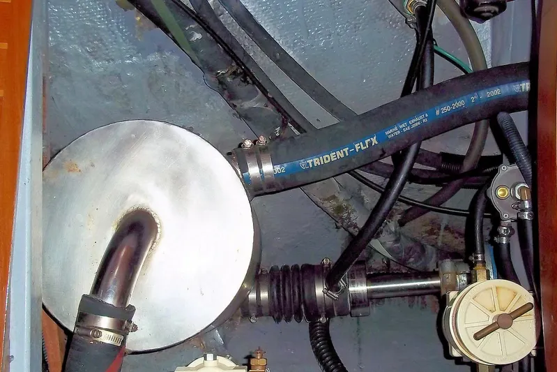 Trouvaille Yacht Photos Pics Engine compartment of 1984 Slocum 43 sailboat with Trident-Flex marine exhaust hose.