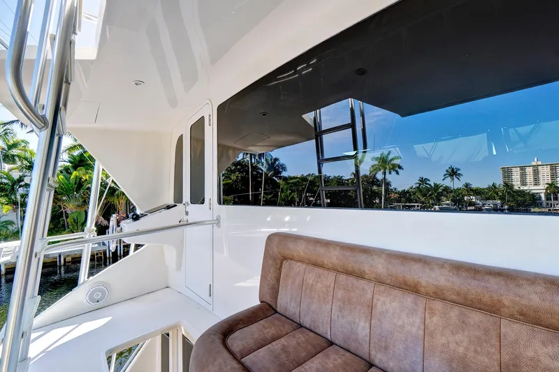  Yacht Photos Pics Luxurious 2008 Viking 74 Enclosed Bridge yacht with plush seating and scenic view.