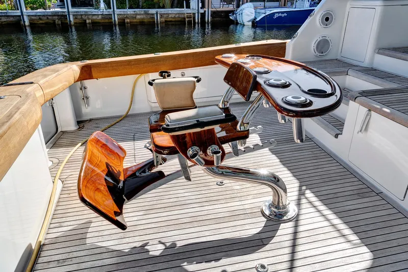  Yacht Photos Pics Luxury fishing chair on 2008 Viking 74 Enclosed Bridge yacht deck, with rod holders.