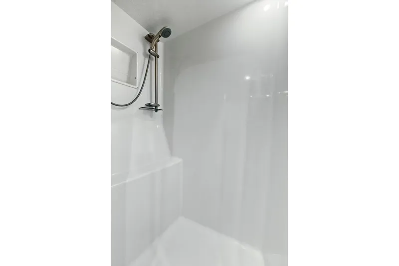  Yacht Photos Pics Shower area in 2008 Viking 74 Enclosed Bridge yacht, featuring sleek white design.