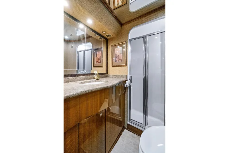  Yacht Photos Pics Luxurious bathroom in 2008 Viking 74 Enclosed Bridge yacht with elegant fixtures and shower.