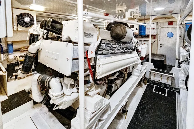  Yacht Photos Pics Engine room of 2008 Viking 74 Enclosed Bridge yacht, featuring powerful machinery and equipment.