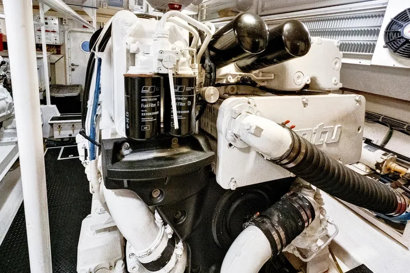  Yacht Photos Pics Engine room of 2008 Viking 74 Enclosed Bridge yacht, featuring MTU components and fuel filters.