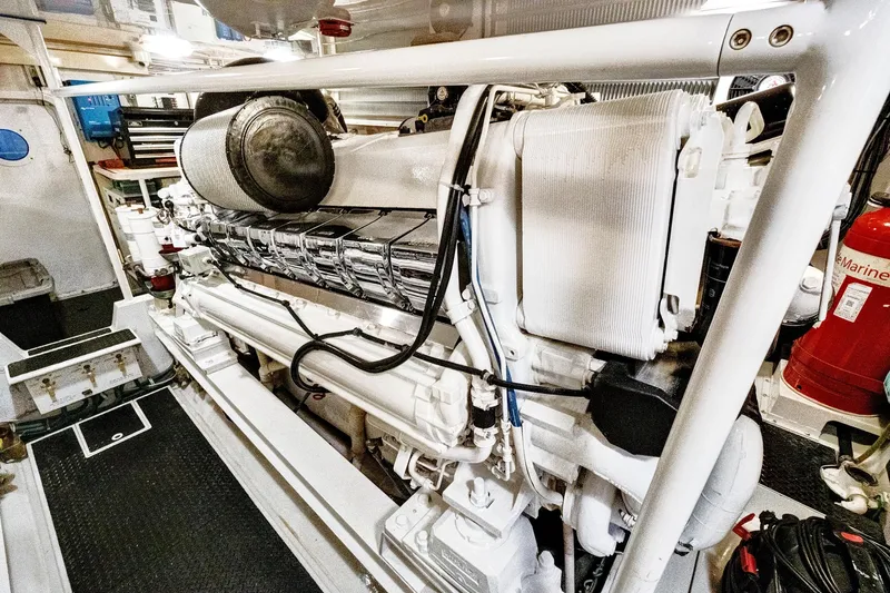  Yacht Photos Pics Engine room of 2008 Viking 74 Enclosed Bridge yacht, showcasing powerful machinery and equipment.