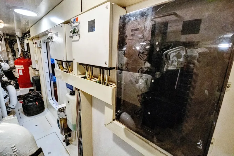  Yacht Photos Pics Engine room of 2008 Viking 74 Enclosed Bridge yacht, featuring control panels and equipment.