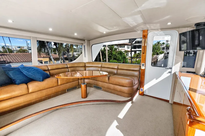  Yacht Photos Pics Luxurious interior of 2008 Viking 74 Enclosed Bridge yacht with leather seating and scenic windows.