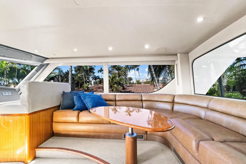  Yacht Photos Pics Luxurious interior of 2008 Viking 74 Enclosed Bridge yacht with leather seating and panoramic windows.