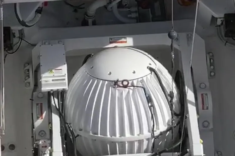  Yacht Photos Pics Close-up of a 2008 Viking 74 Enclosed Bridge boat component, featuring a white mechanical structure.