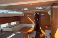 Interior of 2020 Bavaria C45 yacht with modern wood finish and seating area.