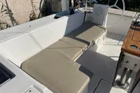 2020 Bavaria C45 yacht cockpit with beige seating and steering wheel.