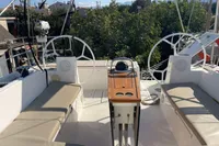 2020 Bavaria C45 yacht cockpit with dual steering wheels and cushioned seating.