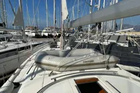 Bavaria C45 yacht 2020 model with inflatable dinghy on deck, docked in marina.