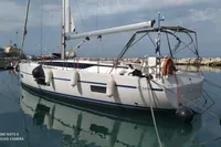 2020 Bavaria C45 sailboat docked in a marina, reflecting on calm water.