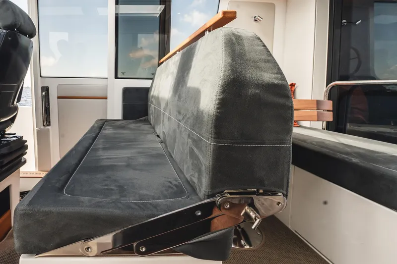 Lady Lindy Yacht Photos Pics Interior seating of 2021 Nimbus C-11 boat, featuring sleek design and comfortable upholstery.