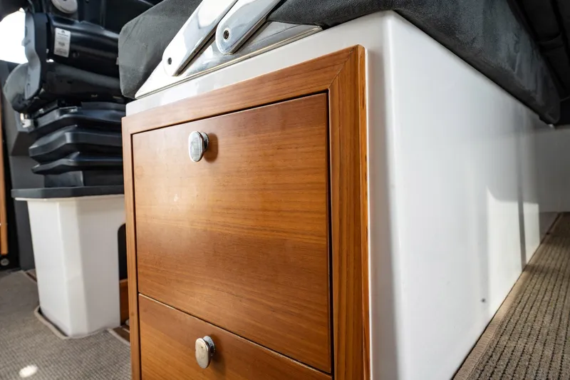 Lady Lindy Yacht Photos Pics Wooden storage drawers in a 2021 Nimbus C-11 boat interior.