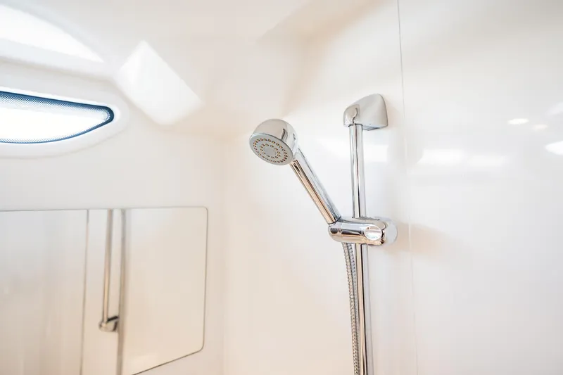 Lady Lindy Yacht Photos Pics Shower area in 2021 Nimbus C-11 boat, featuring sleek chrome fixtures and modern design.