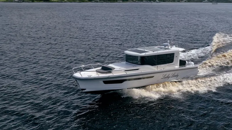 Lady Lindy Yacht Photos Pics 2021 Nimbus C-11 boat cruising on open water, showcasing sleek design and performance.