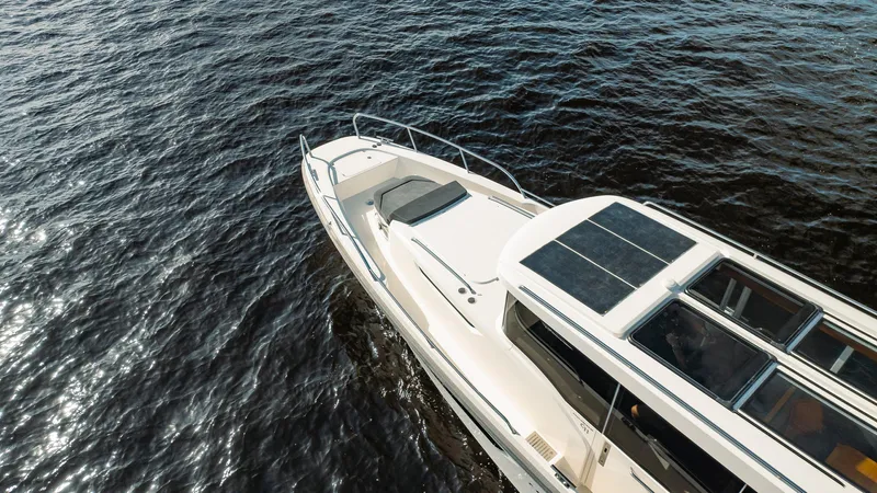 Lady Lindy Yacht Photos Pics Nimbus C-11 2021 boat cruising on open water, top view.