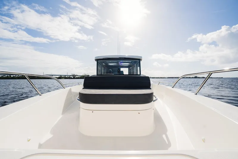 Lady Lindy Yacht Photos Pics Nimbus C-11 boat, 2021 model, cruising on open water under a bright sky.