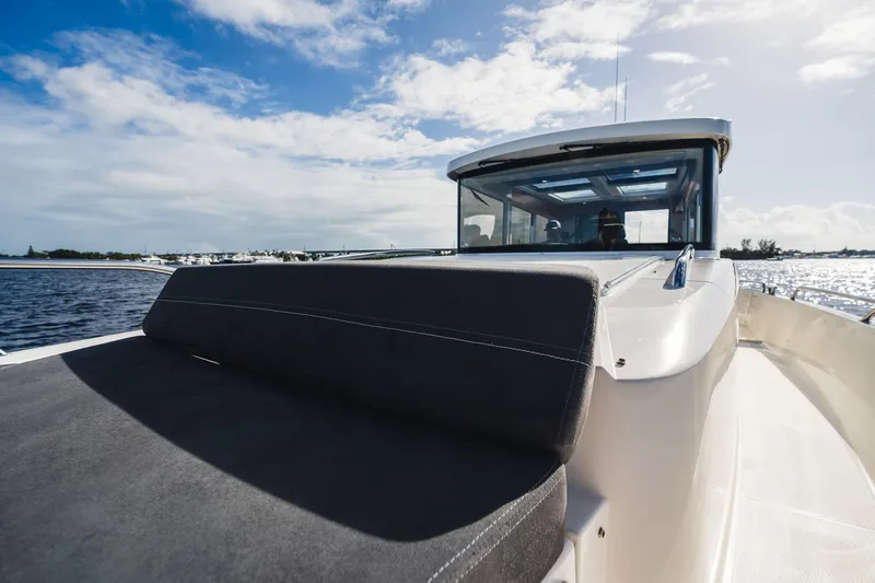 Lady Lindy Yacht Photos Pics 2021 Nimbus C-11 boat on water under blue sky.