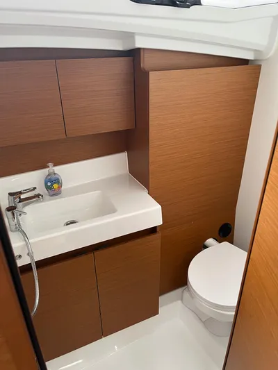 Resfeber Yacht Photos Pics 2023 Jeanneau Sun Odyssey 380 bathroom with modern sink and toilet.