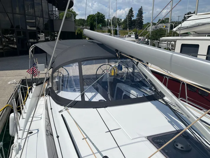 Resfeber Yacht Photos Pics 2023 Jeanneau Sun Odyssey 380 sailboat docked, featuring sleek design and modern canopy.