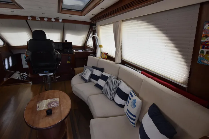 Vesuvio Yacht Photos Pics Luxurious interior of 2007 Pacific Prestige 170 yacht with plush seating and nautical decor.