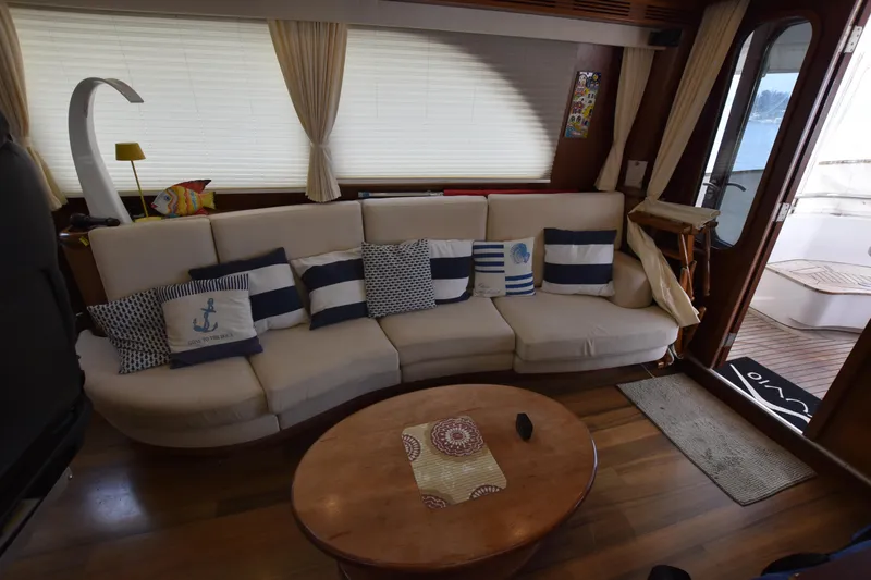 Vesuvio Yacht Photos Pics Luxurious interior of 2007 Pacific Prestige 170 yacht with cozy seating and nautical decor.