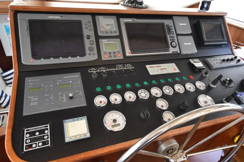 Vesuvio Yacht Photos Pics Control panel of a 2007 Pacific Prestige 170 yacht with navigation instruments and gauges.