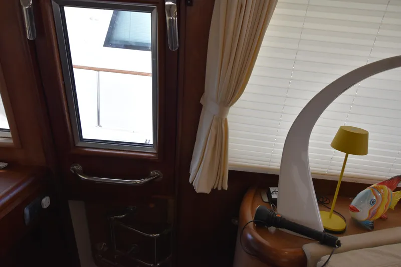 Vesuvio Yacht Photos Pics Interior of 2007 Pacific Prestige 170 yacht with window, curtain, and decorative items.