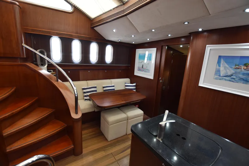 Vesuvio Yacht Photos Pics Luxurious 2007 Pacific Prestige 170 yacht interior with elegant wood finish and modern amenities.