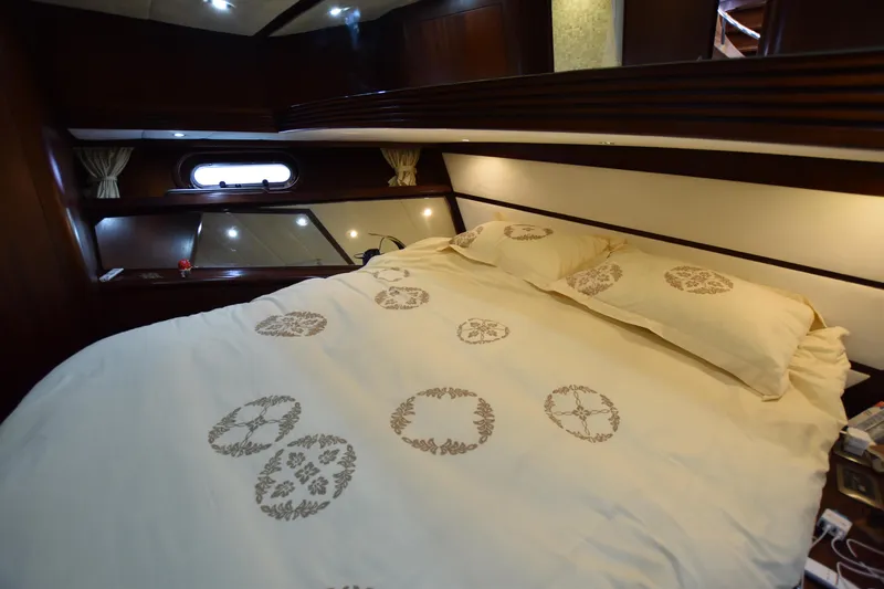 Vesuvio Yacht Photos Pics Luxurious cabin interior of 2007 Pacific Prestige 170 yacht with elegant bedding.