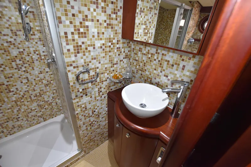 Vesuvio Yacht Photos Pics Luxurious bathroom in 2007 Pacific Prestige 170 yacht with mosaic tiles and modern fixtures.