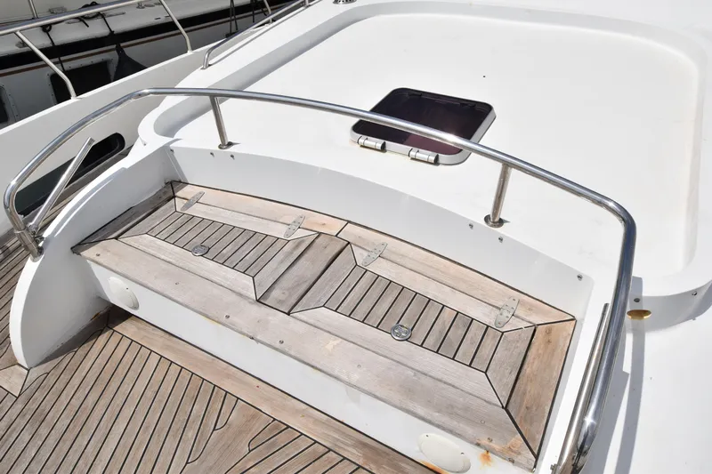 Vesuvio Yacht Photos Pics Wooden deck of 2007 Pacific Prestige 170 yacht with railing and hatch.