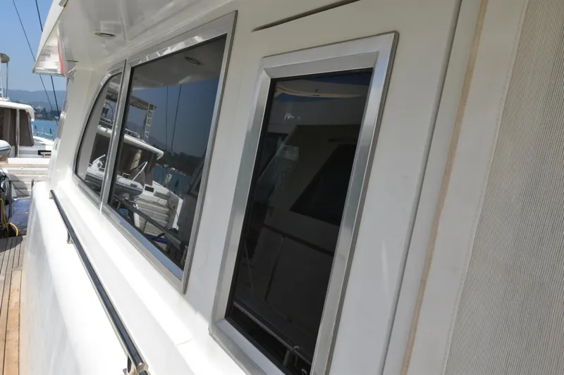 Vesuvio Yacht Photos Pics Side view of a 2007 Pacific Prestige 170 yacht with sleek windows and white exterior.