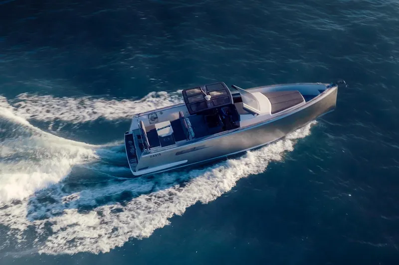 Hummingbird Yacht Photos Pics Fjord 40 Open 2008 yacht cruising on open water, aerial view.