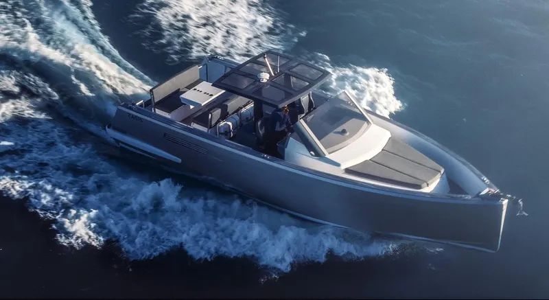 Hummingbird Yacht Photos Pics Fjord 40 Open 2008 yacht cruising on open water, aerial view.