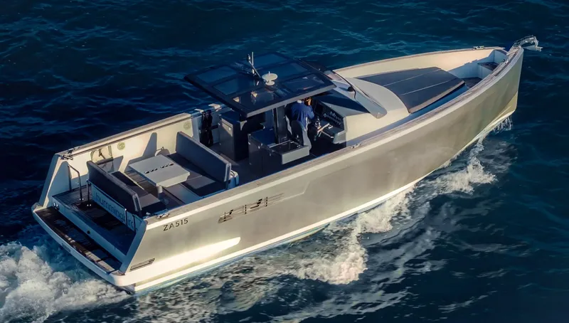 Hummingbird Yacht Photos Pics Fjord 40 Open 2008 yacht cruising on open water, aerial view.