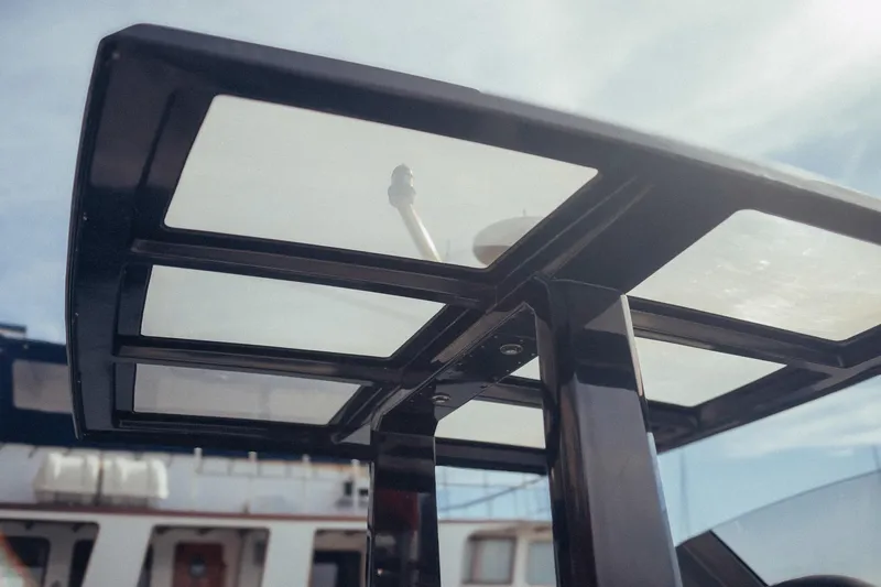 Hummingbird Yacht Photos Pics Fjord 40 Open 2008 boat canopy with clear panels under blue sky.