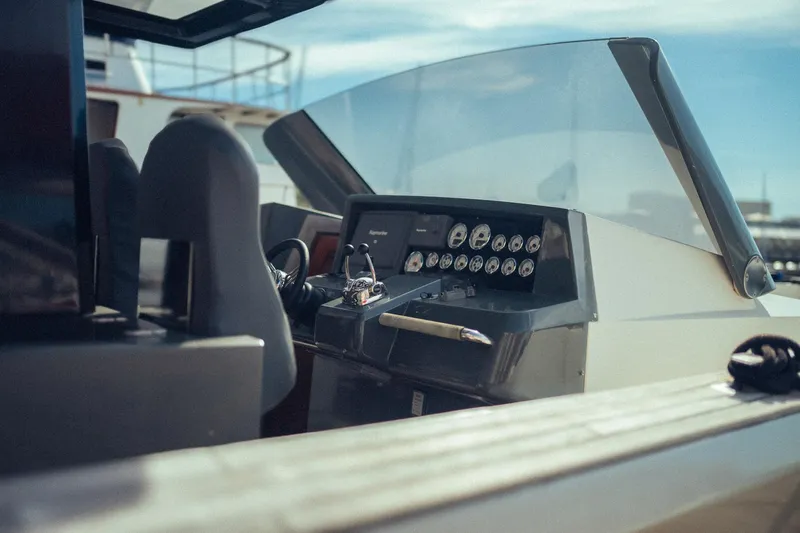 Hummingbird Yacht Photos Pics Helm of 2008 Fjord 40 Open boat with gauges and steering wheel.