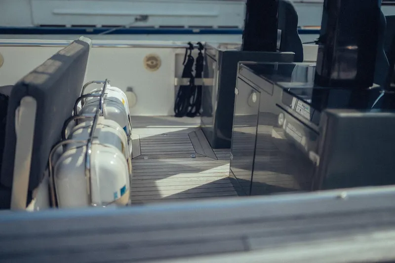 Hummingbird Yacht Photos Pics Interior view of a 2008 Fjord 40 Open yacht, featuring seating and life preservers.