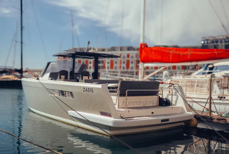 Hummingbird Yacht Photos Pics Fjord 40 Open 2008 yacht docked in marina, featuring sleek design and modern architecture.