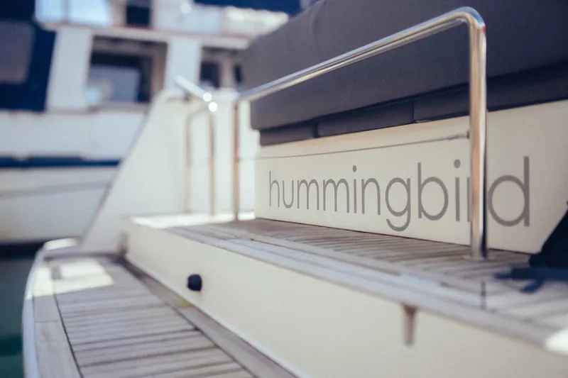 Hummingbird Yacht Photos Pics Fjord 40 Open 2008 yacht with "hummingbird" text on deck railing.