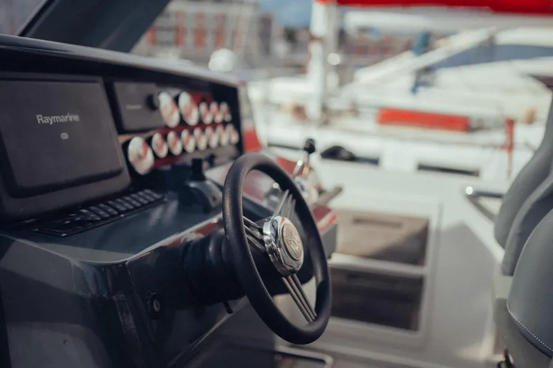 Hummingbird Yacht Photos Pics Steering wheel and dashboard of a 2008 Fjord 40 Open yacht.