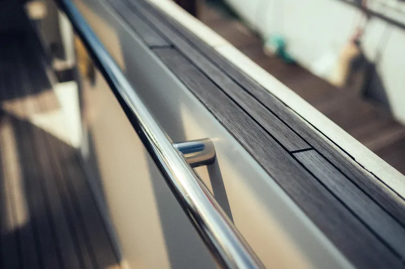 Hummingbird Yacht Photos Pics Close-up of a 2008 Fjord 40 Open yacht's sleek railing and deck.