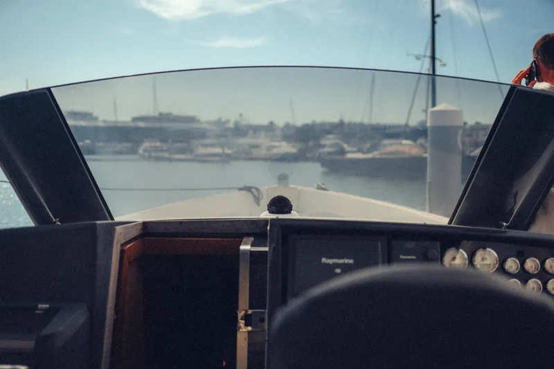 Hummingbird Yacht Photos Pics Cockpit view of a 2008 Fjord 40 Open yacht in a marina.