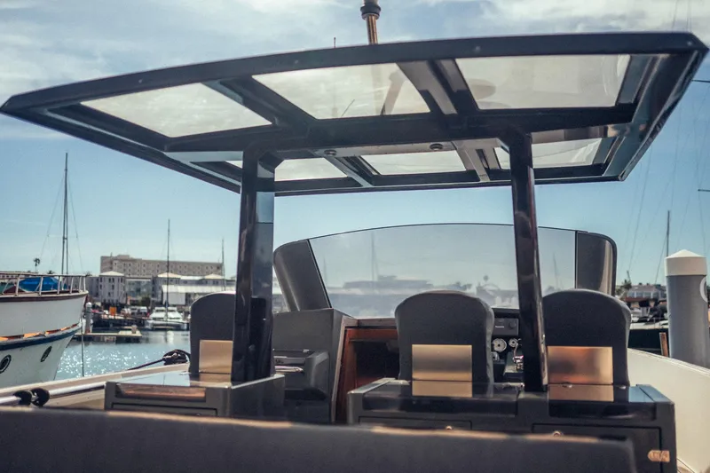 Hummingbird Yacht Photos Pics Fjord 40 Open 2008 yacht with sleek design, docked in a marina under clear skies.