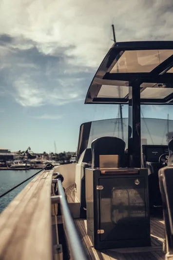 Hummingbird Yacht Photos Pics Fjord 40 Open yacht, 2008 model, docked under a partly cloudy sky.